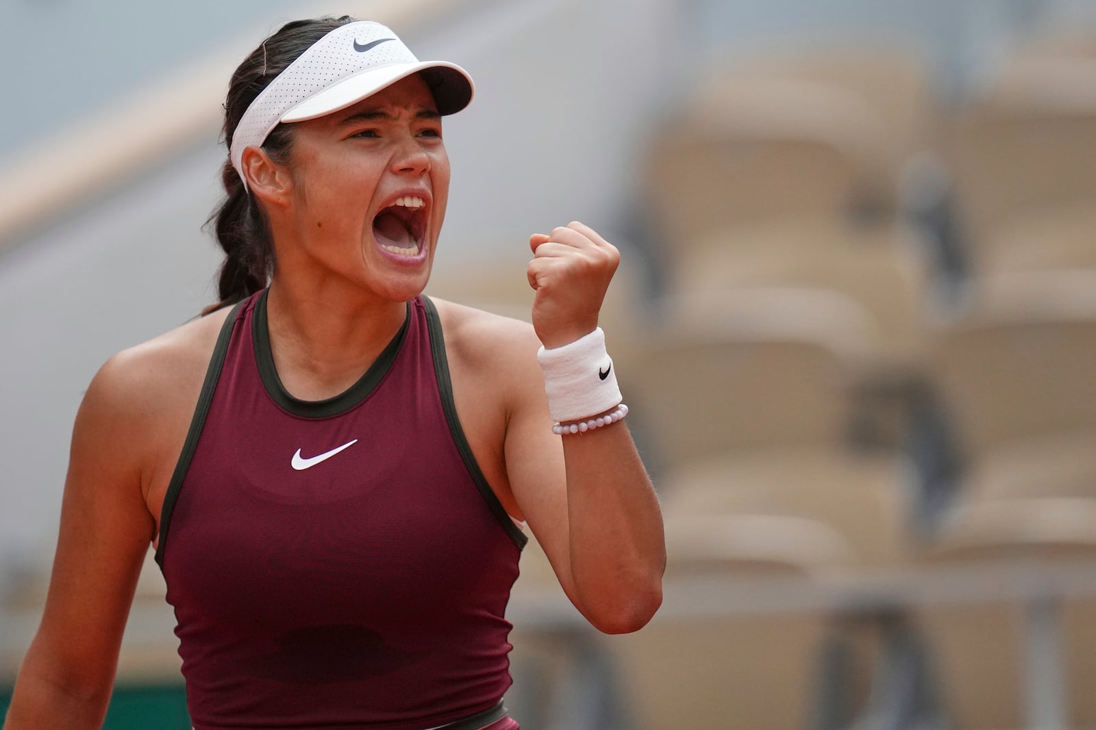Britain's Emma Raducanu reacts winning a point to Poland's Iga Swiatek during their second round match of the French Tennis Open, at the Roland-Garros stadium, in Paris, Wednesday, May 28, 2025. (AP Photo/Christophe Ena)