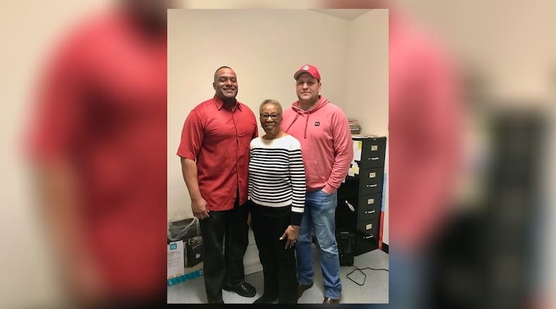 Fire Division Lieutenant and chaplain Bruce Kelley (left), Ella Barnes, Charles Barnes widow (middle), and International Association of Firefighters Local 333 (IAFF 333) President Kevin Sanders (right). Contributed