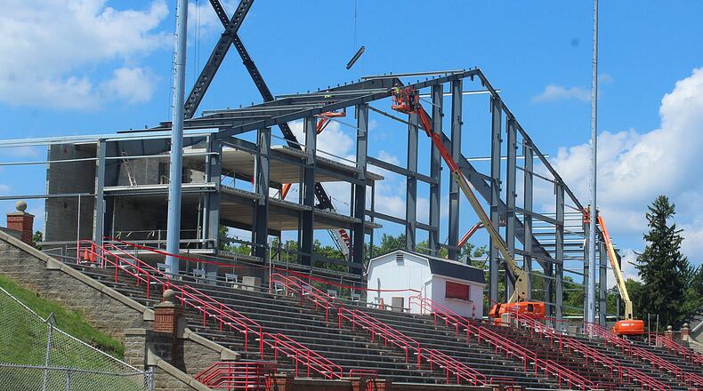 Wittenberg University celebrated raising a 28,000-pound steel beam Friday that signifies progress as the small liberal arts college continues to build a big health, wellness and athletic facility on its campus. JEFF GUERINI/STAFF