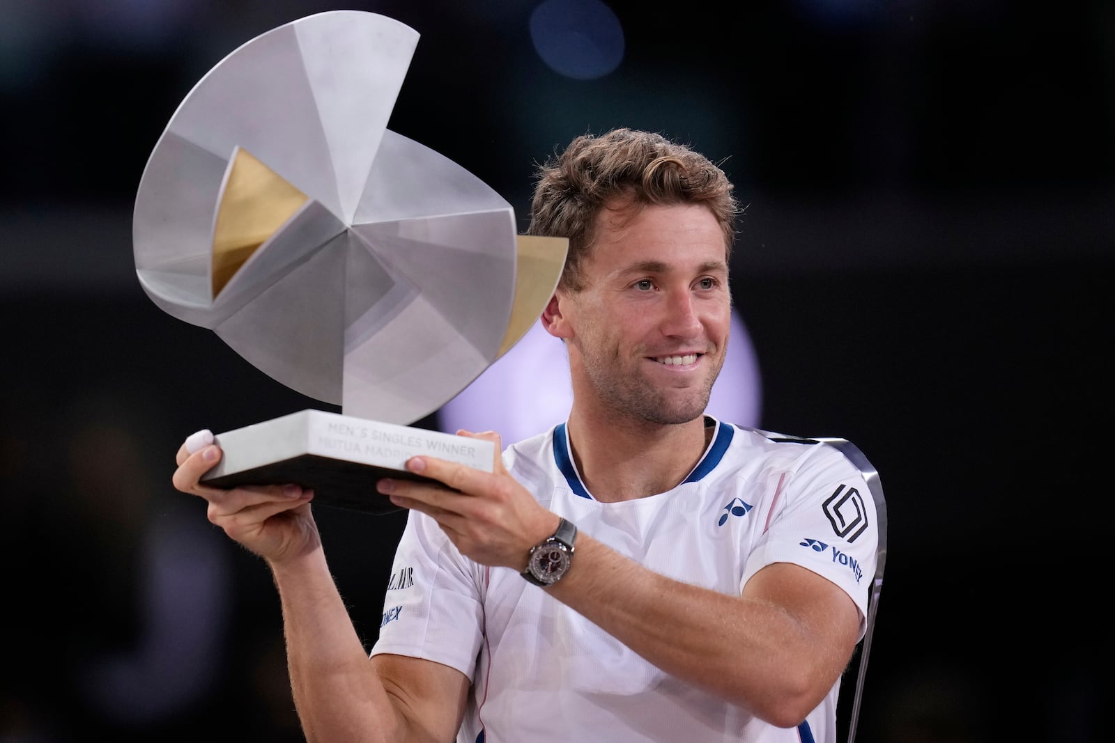 Norway's Casper Ruud holds the trophy after winning the Madrid Open tennis final in Madrid, Spain, Sunday, May 4, 2025. (AP Photo/Manu Fernandez)