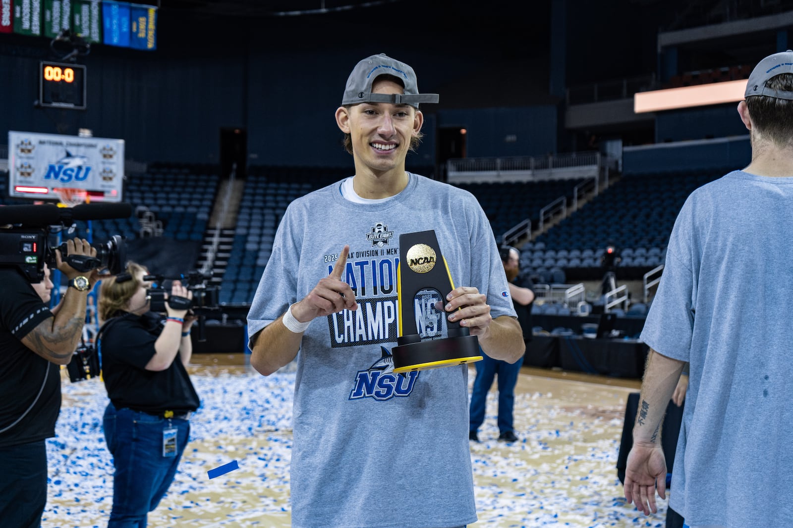 Kenton Ridge grad Tyler Eberhart celebrates with a trophy after Nova Southeastern beat Cal State Dominguez Hills to claim the Division II national title on March 28 in Evansville, Indiana. CONTRIBUTED PHOTO