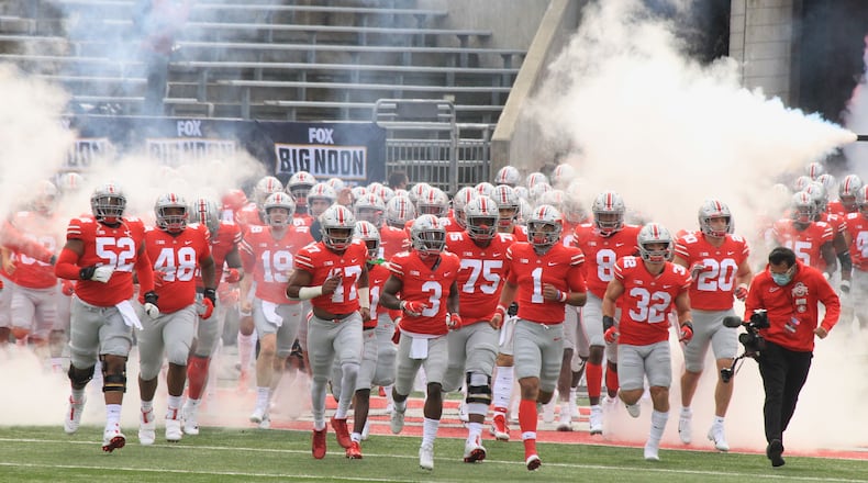 Ohio State runs onto the field before a game against Nebraska on Saturday, Oct. 24, 2020, at Ohio Stadium in Columbus. David Jablonski/Staff