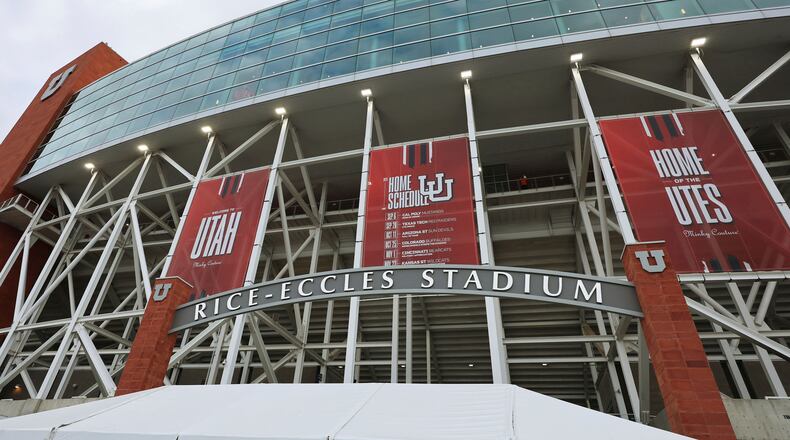 FILE - Banners hang outside Rice Eccles Stadium during an NCAA college football game Sept. 20, 2025, in Salt Lake City, Utah. (AP Photo/Jeffrey D. Allred, File)