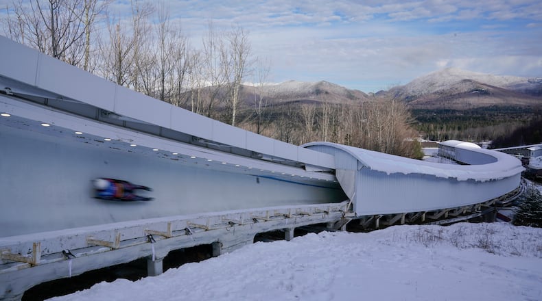 FILE - A luger slides down the track during the World Cup luge event in Lake Placid, N.Y., Dec. 8, 2023. (AP Photo/Seth Wenig, File)