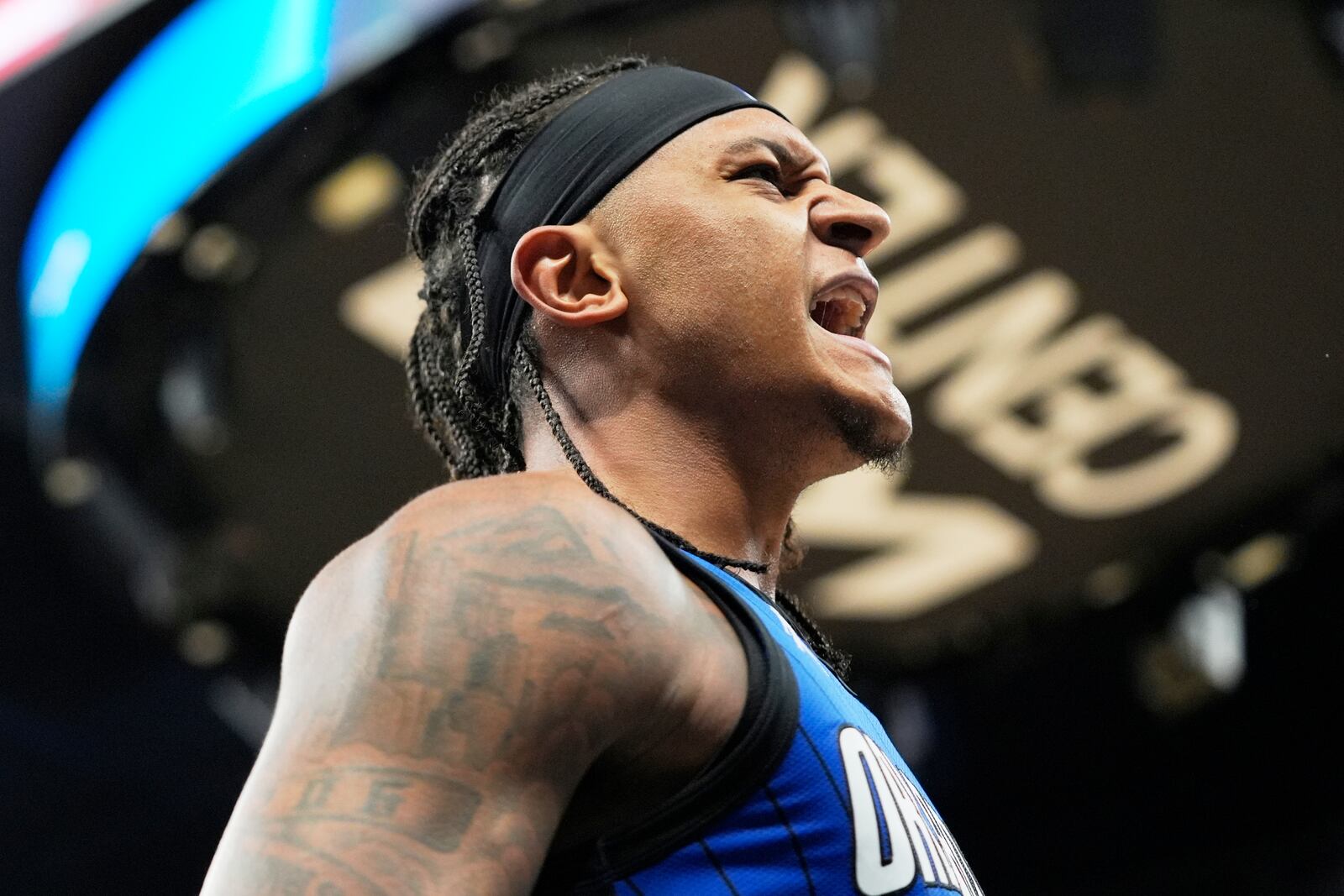 Orlando Magic forward Paolo Banchero celebrates after making a shot and drawing a foul during the second half of an NBA play-in tournament basketball game against the Atlanta Hawks, Tuesday, April 15, 2025, in Orlando, Fla. (AP Photo/John Raoux)