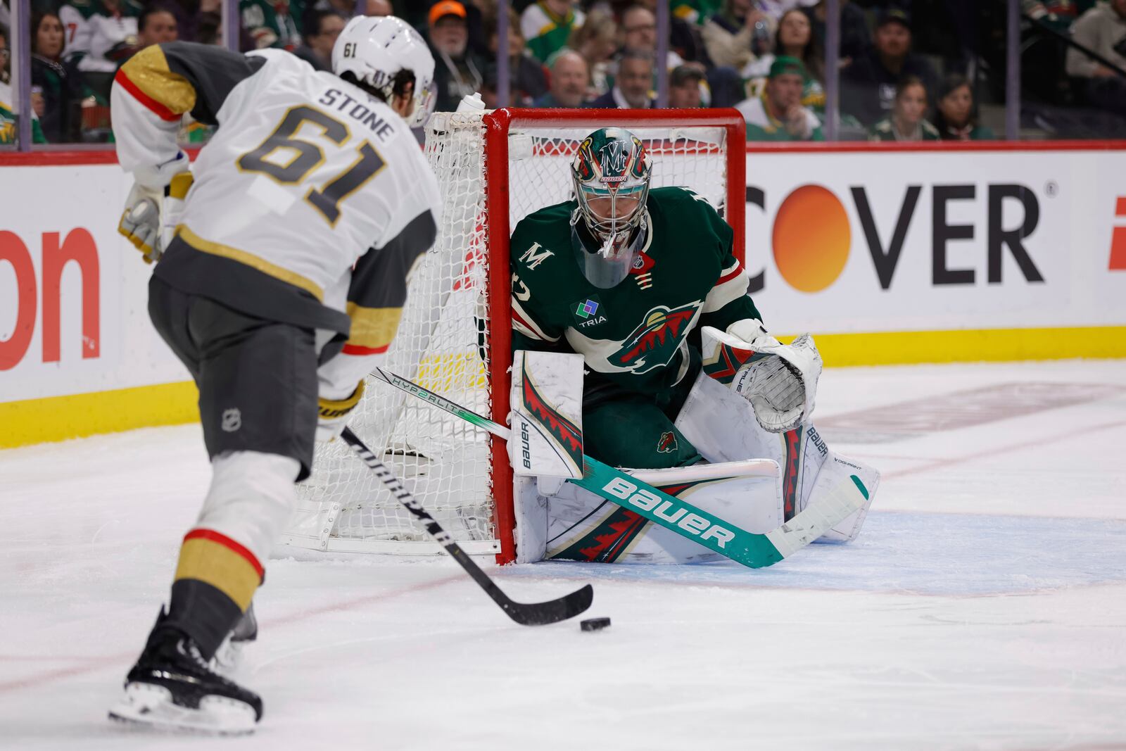 Vegas Golden Knights right wing Mark Stone (61) skates with the puck while Minnesota Wild goaltender Filip Gustavsson defends the net during the second period of Game 6 of a first-round NHL hockey playoff series Thursday, May 1, 2025, in St. Paul, Minn. (AP Photo/Bailey Hillesheim)