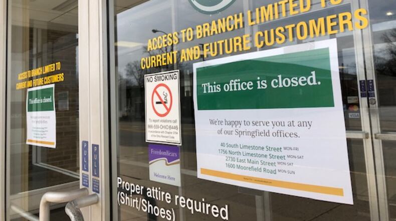 Security National Bank on 920 W. Main St. in Springfield is closed, according to a letter posted on the bank’s door. Bill Lackey/Staff