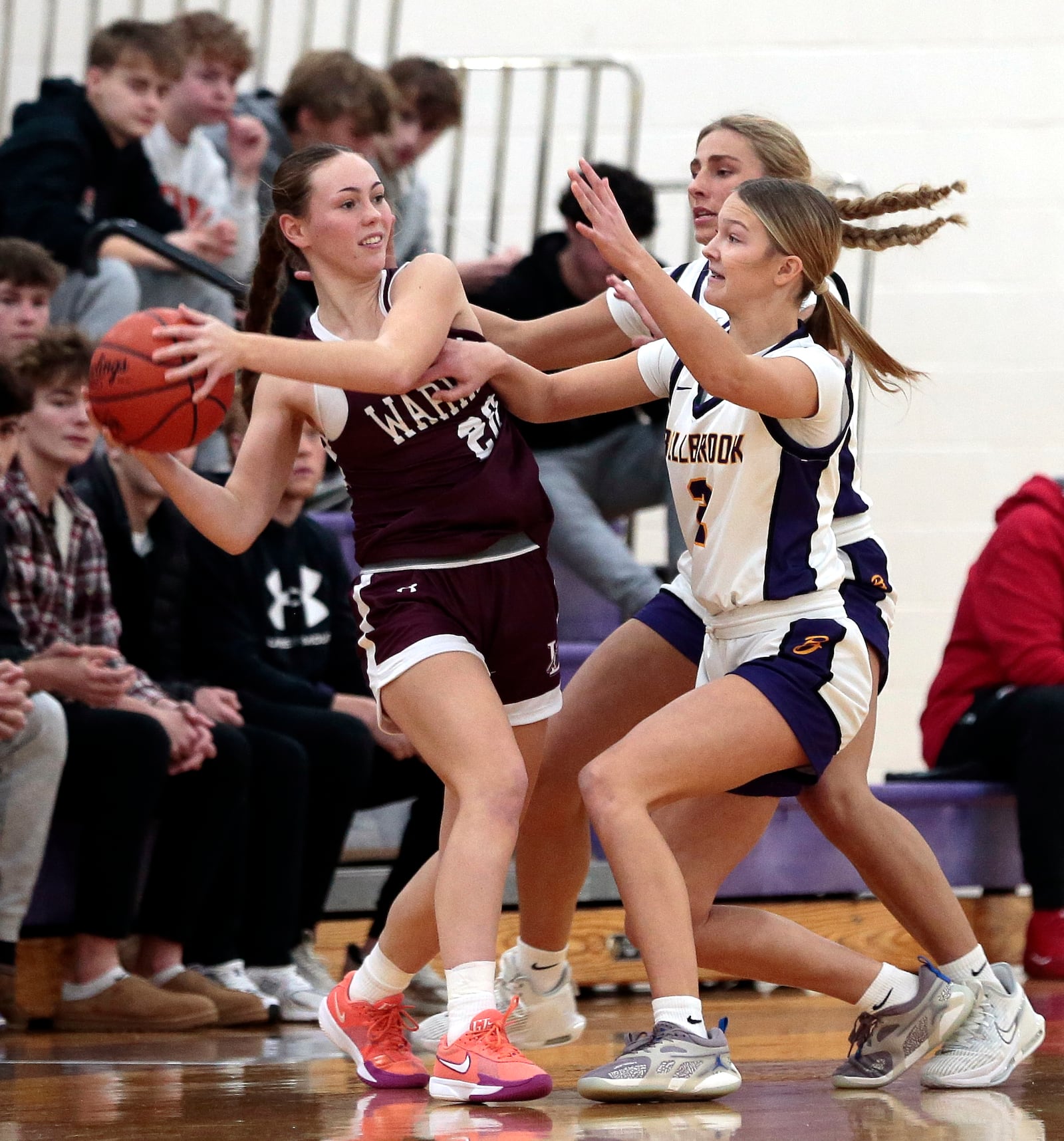 Lebanon junior Alli Kerns is trapped by Bellbrook's Libby Bunsold and Macy Miller. Bellbrook defeated Lebanon 52-39 in a girls basketball game Monday, Dec. 29, 2025, in Bellbrook. STEVEN WRIGHT / STAFF