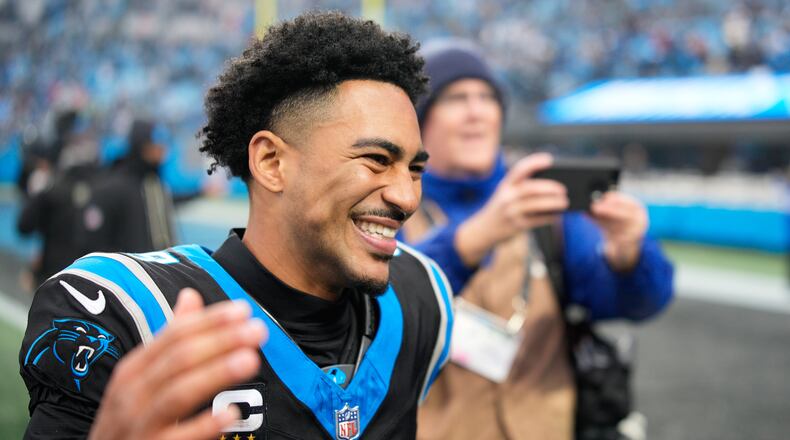 Carolina Panthers quarterback Bryce Young celebrates after an NFL football game between the Carolina Panthers and the Los Angeles Rams, Sunday, Nov. 30, 2025, in Charlotte, N.C. (AP Photo/Jacob Kupferman)