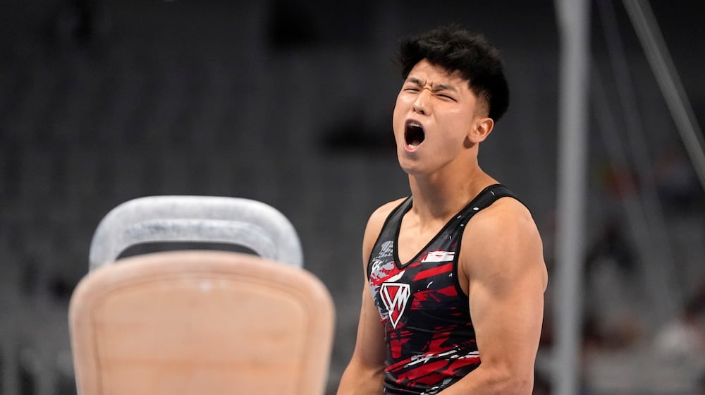 FILE -Yul Moldauer celebrates after competing on the pommel horse during the U.S. gymnastics championships June 1, 2024, in Fort Worth, Texas. (AP Photo/Tony Gutierrez, File)