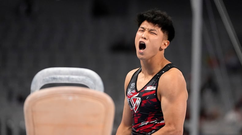 FILE -Yul Moldauer celebrates after competing on the pommel horse during the U.S. gymnastics championships June 1, 2024, in Fort Worth, Texas. (AP Photo/Tony Gutierrez, File)
