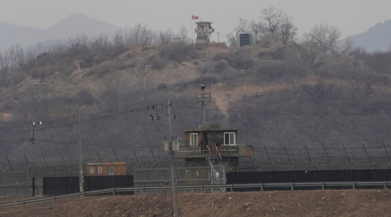 A North Korean military guard post, top, and a South Korean post, bottom, are seen from Paju, South Korea, near the border with North Korea, Thursday, Feb. 26, 2026. (AP Photo/Ahn Young-joon)