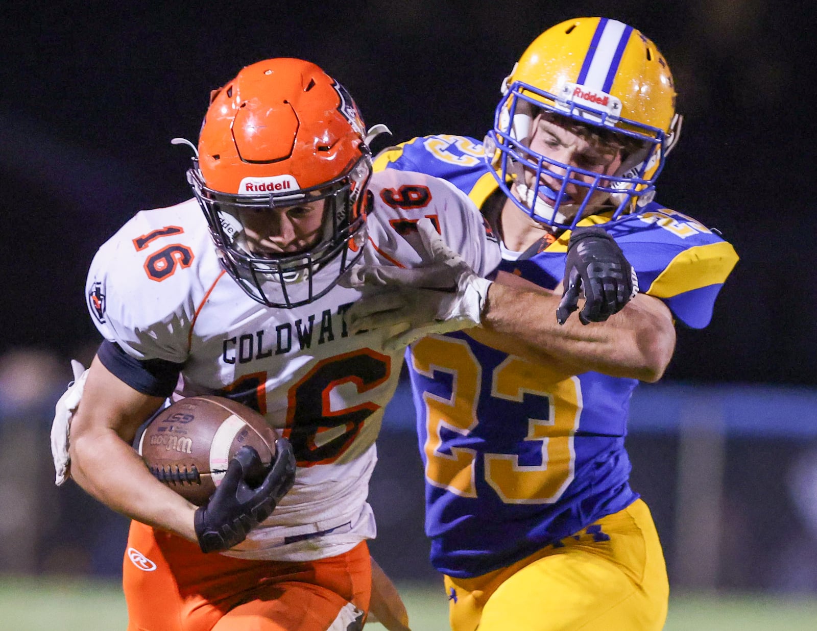 Marion Local senior linebacker Nolan Eckstein tackles Coldwater's Karter Freed during a Midwest Athletic Conference game on Friday, Oct. 24 at Booster Stadium in Maria Stein. BRYANT BILLING/STAFF