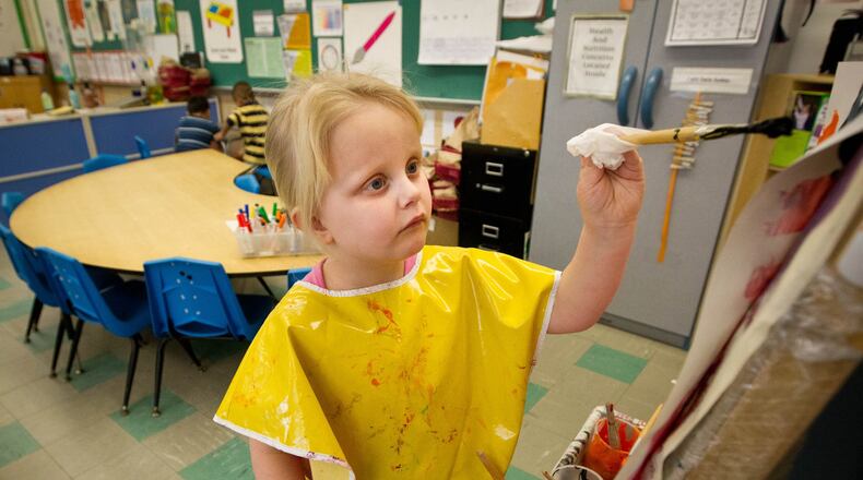 Archive photo: Head Start student Maryann Keydozius works on a painting at Immaculate Conception School, 2268 S. Smithville Road. Staff Photo by Jim Witmer.