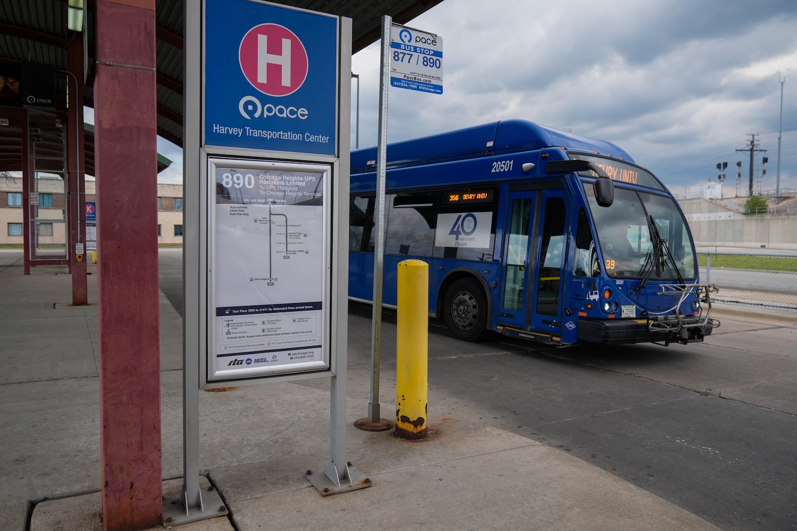A bus leaves the Pace Harvey Transportation Center, Thursday, May 29, 2025, in Harvey, Ill. (AP Photo/Erin Hooley)