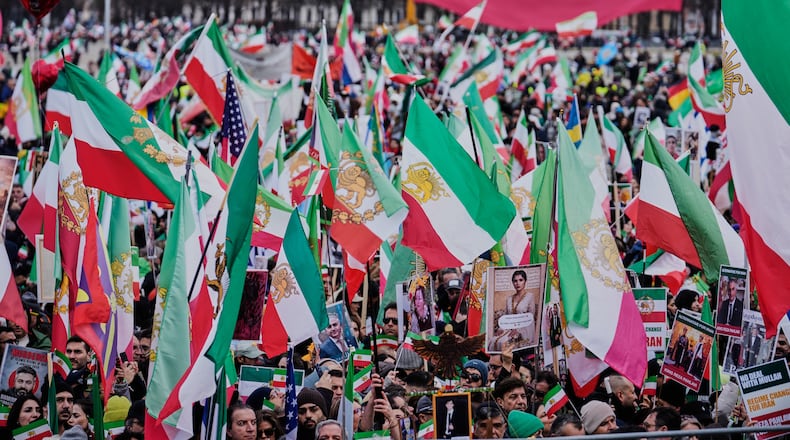Supports of Iran's exiled Crown Prince Reza Pahlavi attend a demonstration during the Munich Security Conference in Munich, Germany, Saturday, Feb. 14, 2026. (AP Photo/Ebrahim Noroozi)