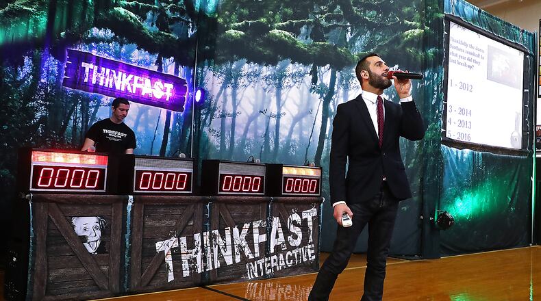 Mattew Karstem, the host of Thinkfast Interactive, asks the Greenon High School student questions about distracted driving during the gameshow style educational program in 2020 in the Greenon gym. BILL LACKEY/STAFF