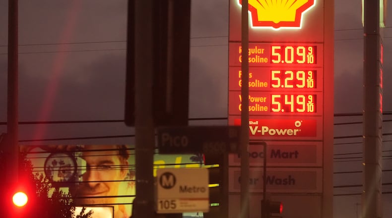 Gas prices are displayed, Monday, March 9, 2026, in Los Angeles. (AP Photo/Damian Dovarganes)