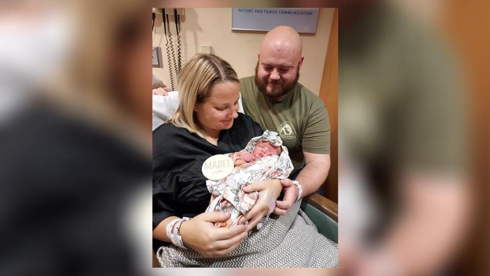 Kirstyn and Brad Stapleton hold their daughter, Mabel Mae. Mabel arrived into the New Year after 2 a.m. Monday morning.
