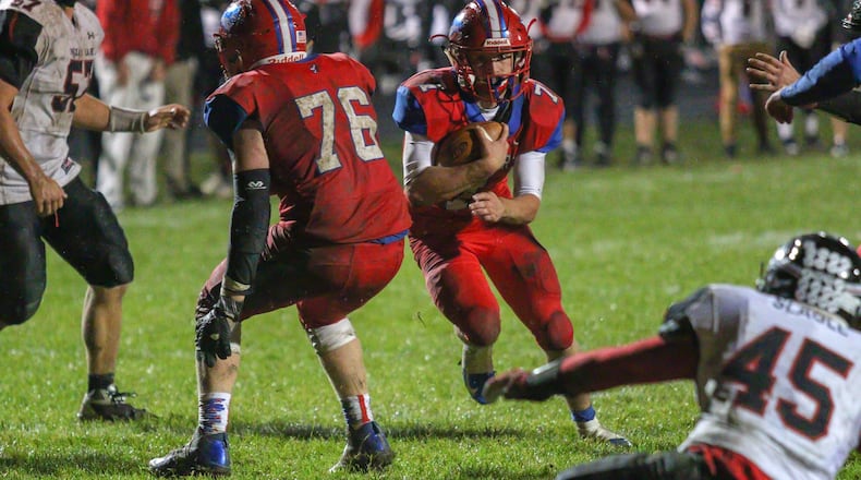 Northwestern High School senior Eli Berner runs into the end zone during their game against Indian Lake at Taylor Field in Springfield. Berner scored on the play and finished with 133 yards rushing. The Lakers won the game 8-7. Michael Cooper/CONTRIBUTED