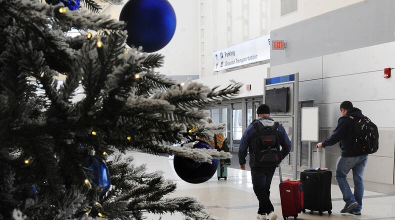 Holiday travel is expected to be up this year nationwide and in Ohio including the Dayton International Airport and almost back to pre-pandemic levels. MARSHALL GORBY\STAFF
