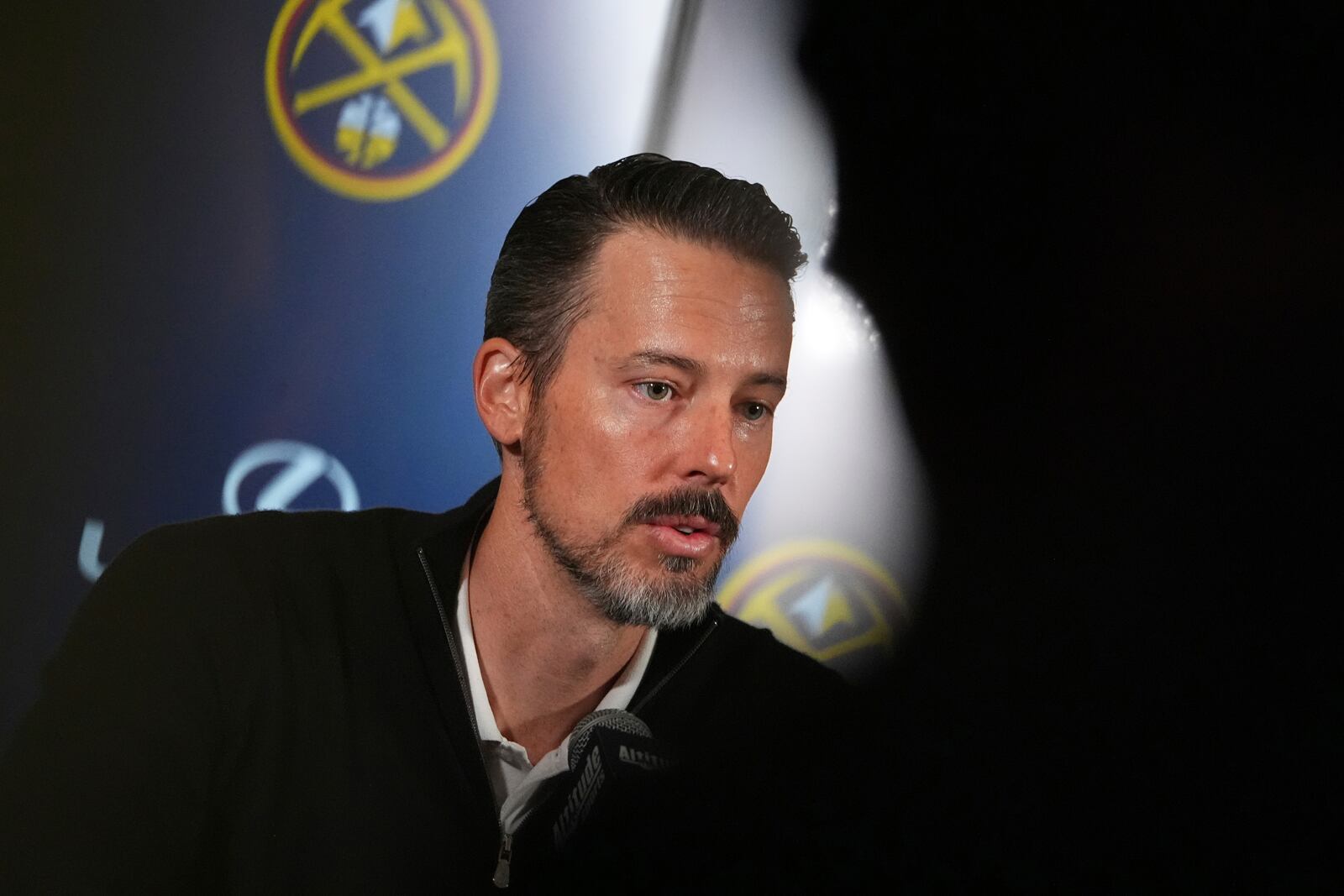 Denver Nuggets team president Josh Kroenke responds to questions at a news conference Monday, April 14, 2025, in Denver about the firing of the team's general manager and head coach last week. (AP Photo/David Zalubowski)