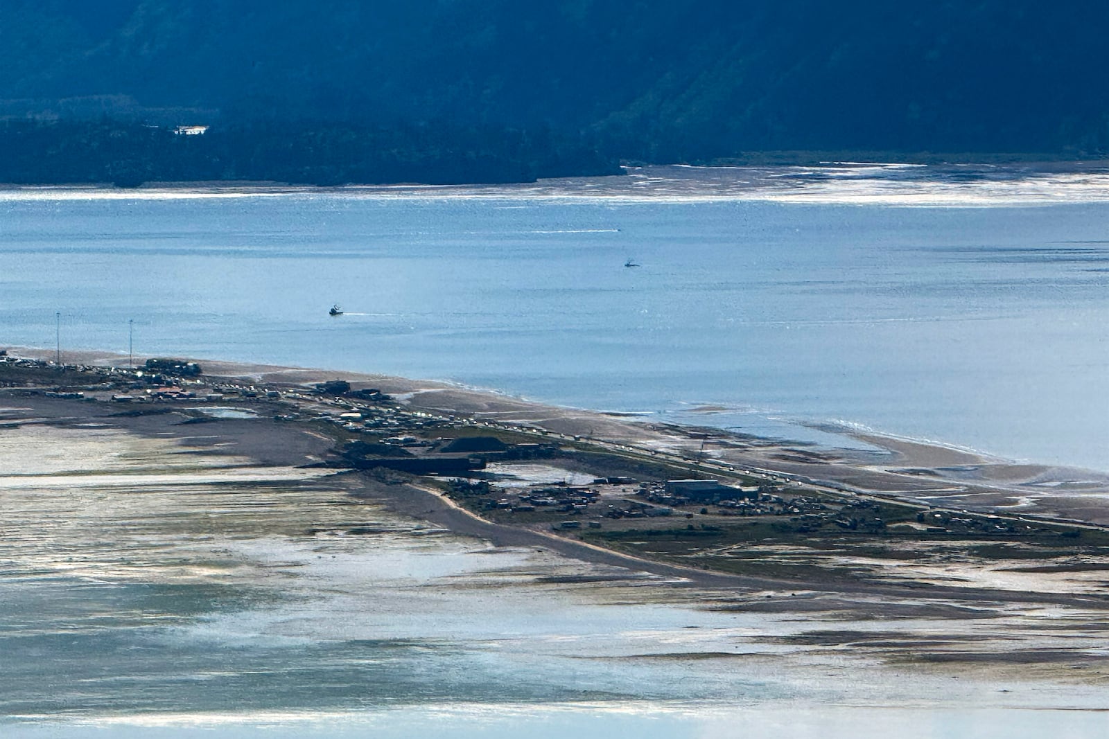 In this image provided by Tim Hatfield, cars leave Homer Spit on Wednesday, July 16, 2025, in Homer, Alaska. (Tim Hatfield via AP)