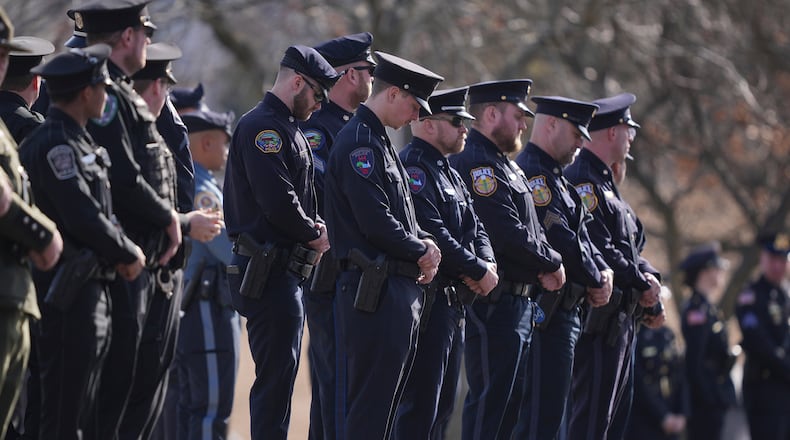 FILE - Officers wait for slain West York Borough Police Officer Andrew Duarte's funeral procession from Living Word Community Church, in Red Lion, Pa., Feb. 28, 2025. (AP Photo/Matt Rourke, File)