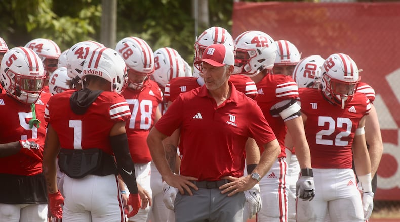 Wittenberg's Jim Colllins prepares to lead the team onto the field before a game against Washington and Lee on Saturday, Sept. 13, 2025, at Edwards-Maurer Field in Springfield. David Jablonski/Staff
