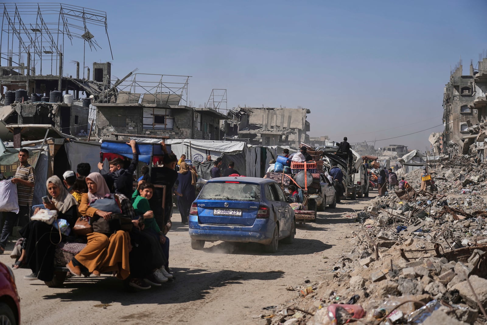 Displaced Palestinians fleeing Beit Lahia amid ongoing Israeli military operations in the Gaza Strip arrive in Jabalia, northern Gaza, on Friday, May 16, 2025. (AP Photo/Jehad Alshrafi)