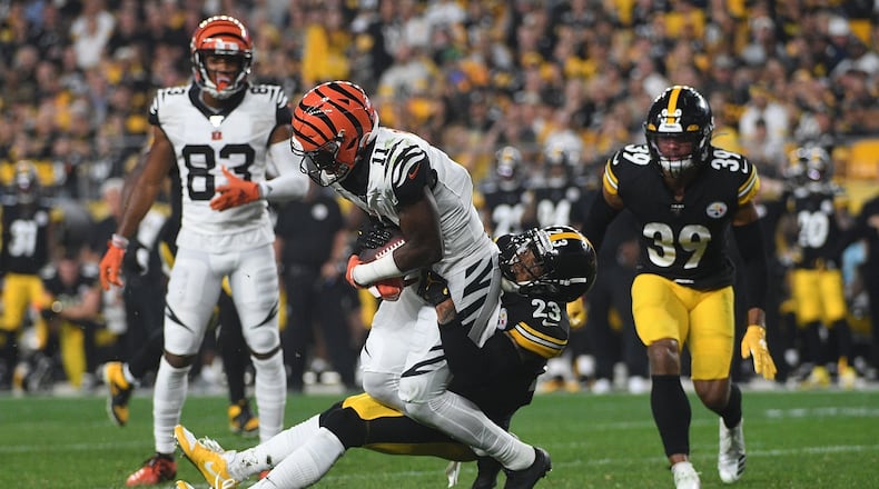 PITTSBURGH, PA - SEPTEMBER 30: John Ross #11 of the Cincinnati Bengals is wrapped up for a tackle by Joe Haden #23 of the Pittsburgh Steelers in the second half during the game at Heinz Field on September 30, 2019 in Pittsburgh, Pennsylvania. (Photo by Justin Berl/Getty Images)