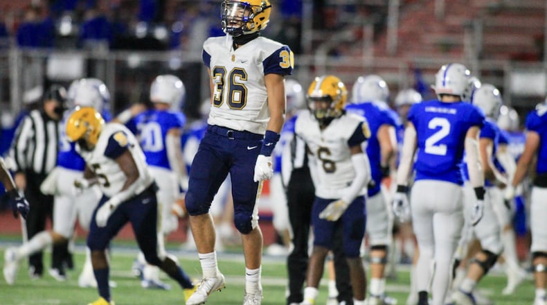 Springfield's Delian Bradley (36) celebrates after a play against St. Xavier in a Division I state semifinal on Friday, Nov. 6, 2020, at Alexander Stadium in Piqua. David Jablonski/Staff