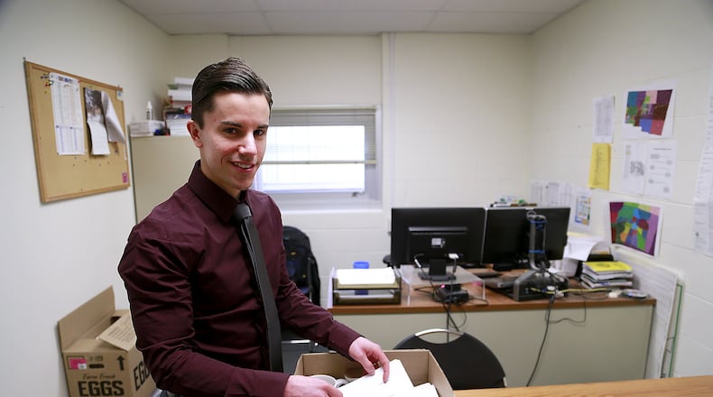 Gabe Jones packs up his office in the Clark County Combined Health District Wednesday. Jones is the new Champaign County Health Commissioner. Bill Lakey/Staff