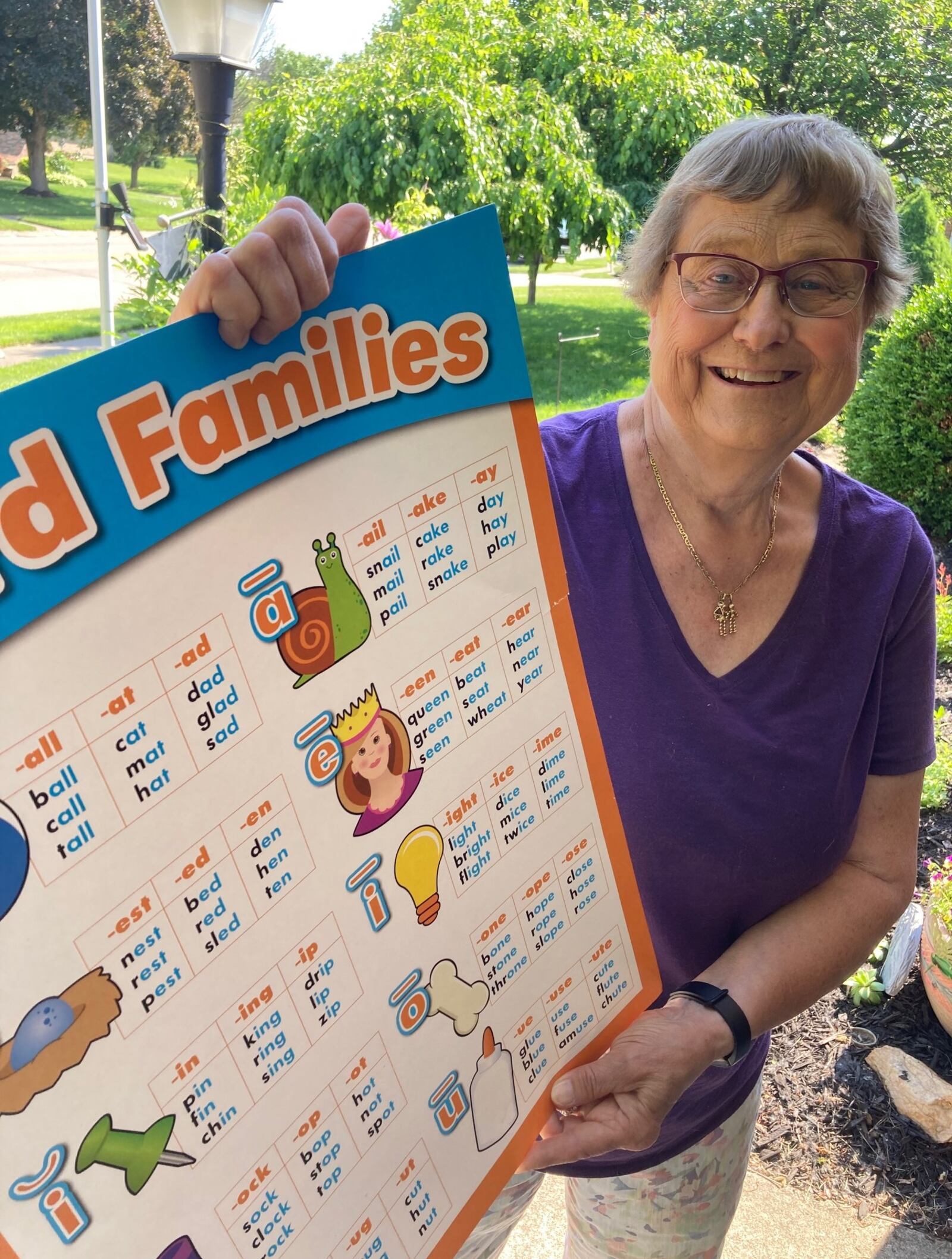 Judy Gran shows one of the charts she uses to teach reading to students with struggles./Contributed
