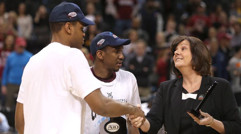 Ronald Roberts. Jr. and Langston Galloway, of the Saint Joseph's Hawks, are presented with A-10 All-Championship Team Awards by Atlantic 10 Commissioner Bernadette V. McGlade after defeating the Virginia Commonwealth Rams during the Championship game of the 2014 Atlantic 10 Men's Basketball Tournament at Barclays Center on March 16, 2014 in the Brooklyn borough of New York City.  (Photo by Mike Lawrie/Getty Images)