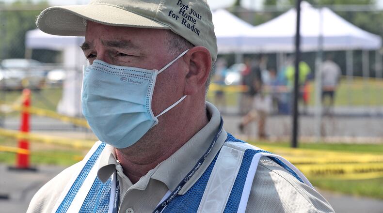 Clark County Health Commissioner Charles Patterson talks to the media about the free COVID-19 clinic and Hayward Middle School Wednesday. BILL LACKEY/STAFF