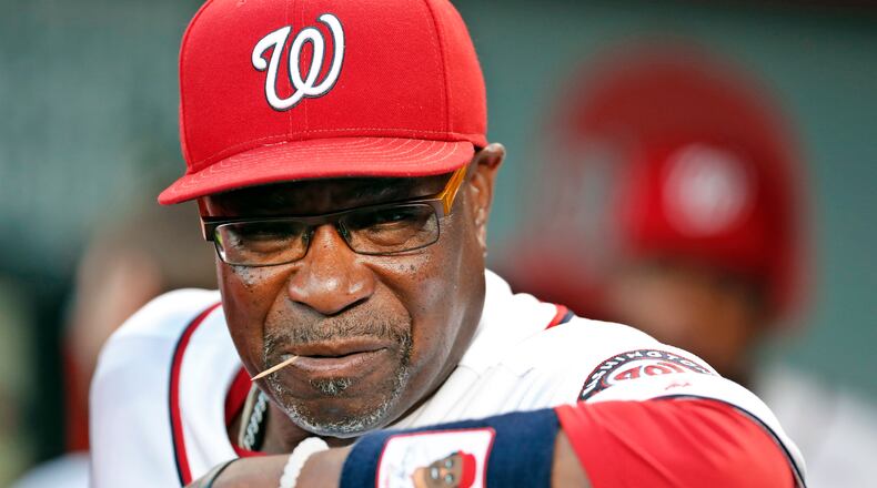 FILE - In this Sept. 13, 2016, file photo, Washington Nationals manager Dusty Baker pauses in the dugout before a baseball game against the New York Mets at Nationals Park in Washington. The Nationals announced Friday, Oct. 20, 2017, that Baker won't be back next season. Baker led the Nationals to the NL East title in each of his two years with the club. But Washington lost its NL Division Series both times. (AP Photo/Alex Brandon, File)