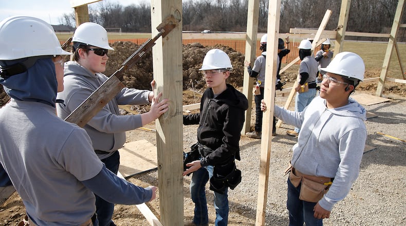 Carpentry students from Springfield/Clark CTC work on building a new shelter house outside of the new Kenton Ridge School Thursday, Feb. 8, 2024. BILL LACKEY/STAFF