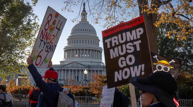 Demonstrators opposed to President Donald Trump protest near the Capitol on Wednesday, Nov. 5, 2025, in Washington. (AP Photo/Mark Schiefelbein)