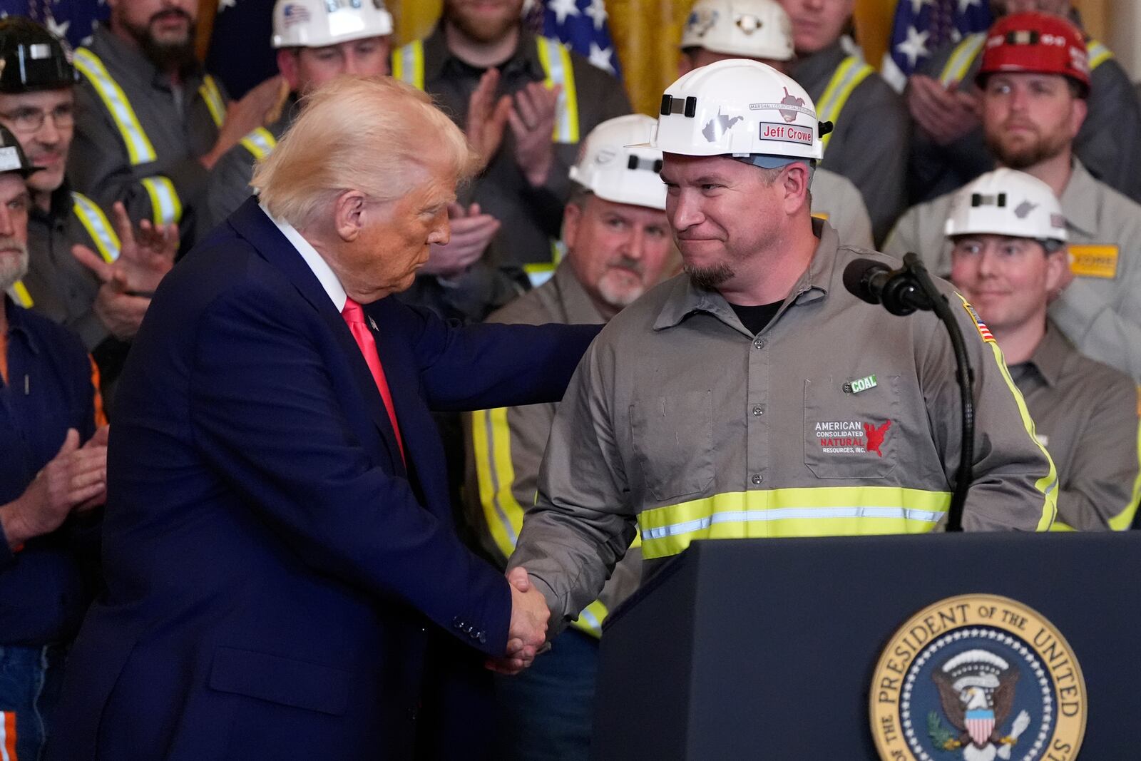 President Donald Trump shakes hands with coal miner Jeff Crowe during an event on energy production in the East Room of the White House, Tuesday, April 8, 2025, in Washington. (AP Photo/Alex Brandon)