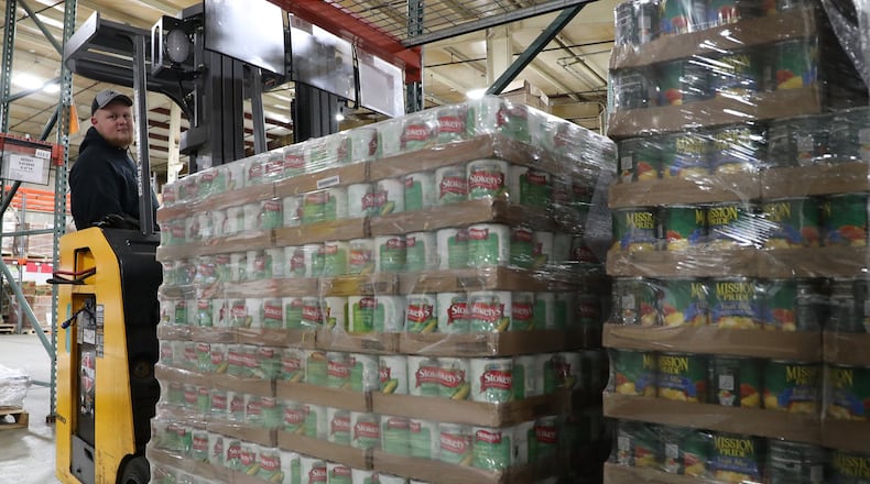 Demand on Second Harvest Food Bank is likely to feel strained as it pushes to serve families and children out of school for the next three weeks due to concerns over coronavirus. BILL LACKEY/STAFF