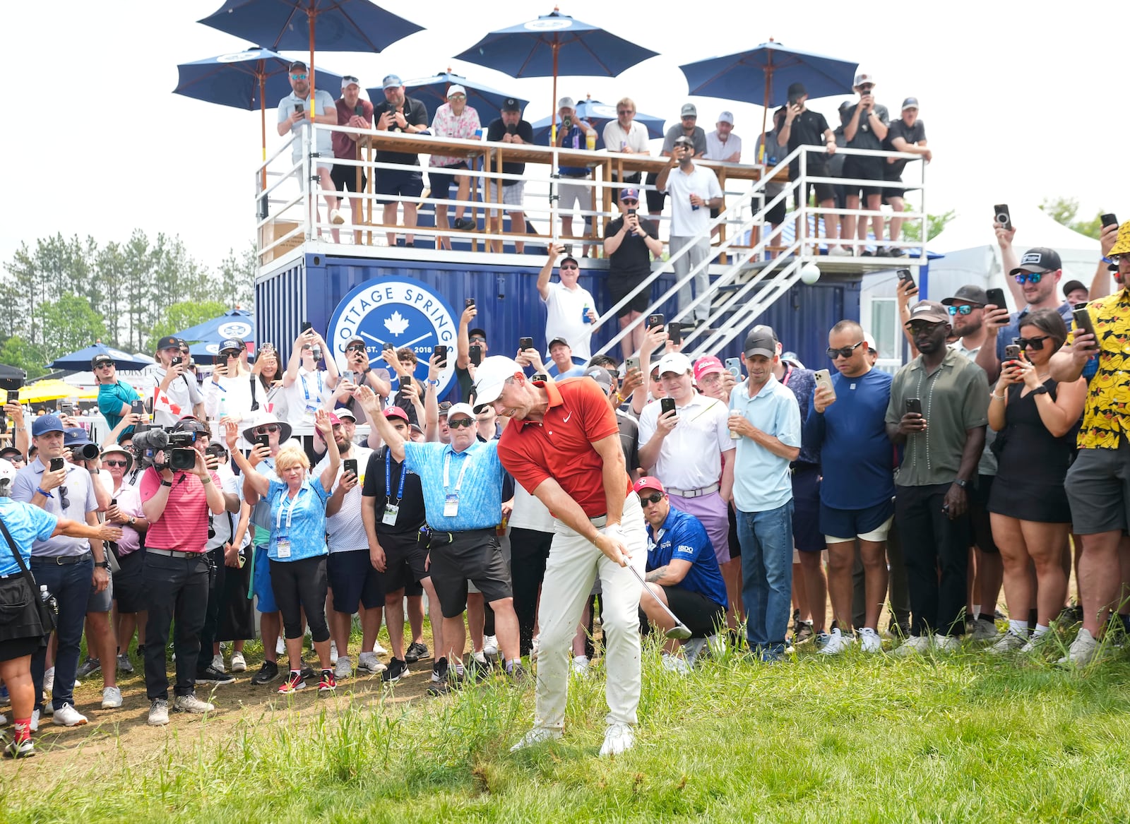 Rory McIlroy hits a chip shot from the rough on the fifth hole during the second round of the Canadian Open golf tournament in Caledon, Ontario, Friday, June 6, 2025. (Nathan Denette/The Canadian Press via AP)