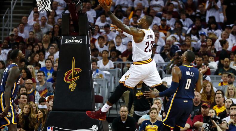 CLEVELAND, OH - APRIL 15: LeBron James #23 of the Cleveland Cavaliers gets to the basket past CJ Miles #0 of the Indiana Pacers during the first half in Game One of the Eastern Conference Quarterfinals during the 2017 NBA Playoffs at Quicken Loans Arena on April 15, 2017 in Cleveland, Ohio. NOTE TO USER: User expressly acknowledges and agrees that, by downloading and or using this photograph, User is consenting to the terms and conditions of the Getty Images License Agreement.  (Photo by Gregory Shamus/Getty Images)
