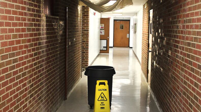 A water leak in one of the hallways at Northeastern High School is one of the reasons the school district wants to build new schools. JEFF GUERINI/STAFF
