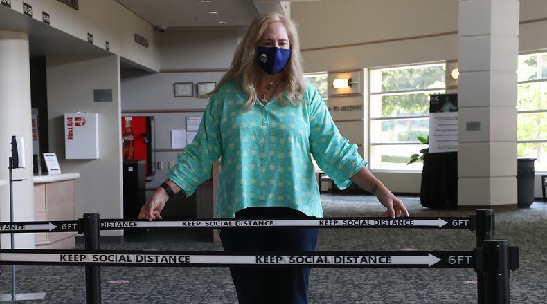 Adele Adkins, executive director of the Clark State Performing Arts Center, talks about some of the items they'll be using to keep people safe when they reopen to the public in October for the first time since March. BILL LACKEY/STAFF