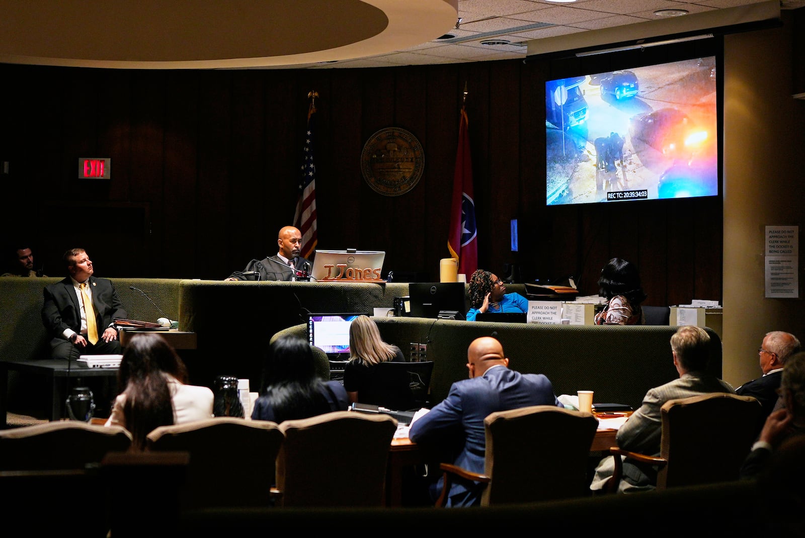 Tennessee Bureau of Investigations Special Agent Derek Miller, left, watches video evidence with members of the court during the trial of three former Memphis police officers accused in the 2023 death of Tyre Nichols, in Memphis, Tenn. Wednesday, April 30, 2025. (AP Photo/George Walker IV, Pool)