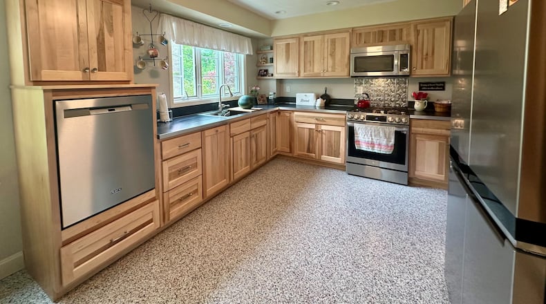 Susan Walters Crowe says the windows (and the yard) drew her to the home she purchased in 2020 with her husband. ROBIN McMACKEN / STAFF