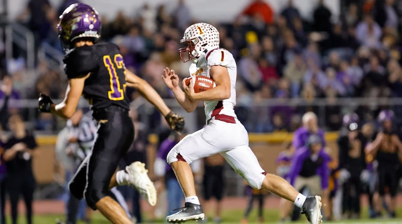 Northeastern High School senior Cody Houseman breaks free for a touchdown during their 52-36 win over Mechanicsburg on Friday, Oct. 17 at Indian Stadium. MICHAEL COOPER / STAFF
