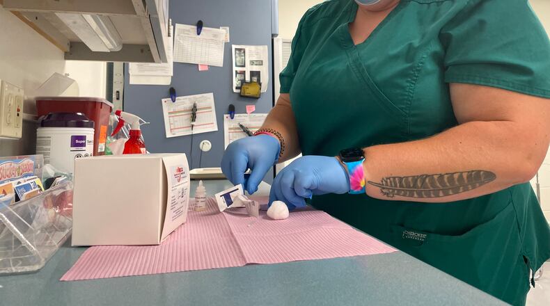 Tara Wagner, a clinic resource nurse, prepare a rapid syphilis test at the Clark County Combined Health District's main office on Friday.