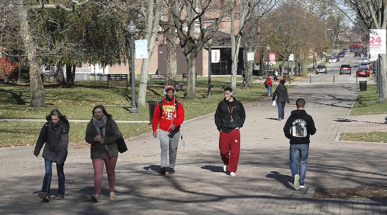 Wittenberg University students walk across campus. According to University President Mike Frandsen, the key to Wittenberg’s future is retaining students. BILL LACKEY/STAFF